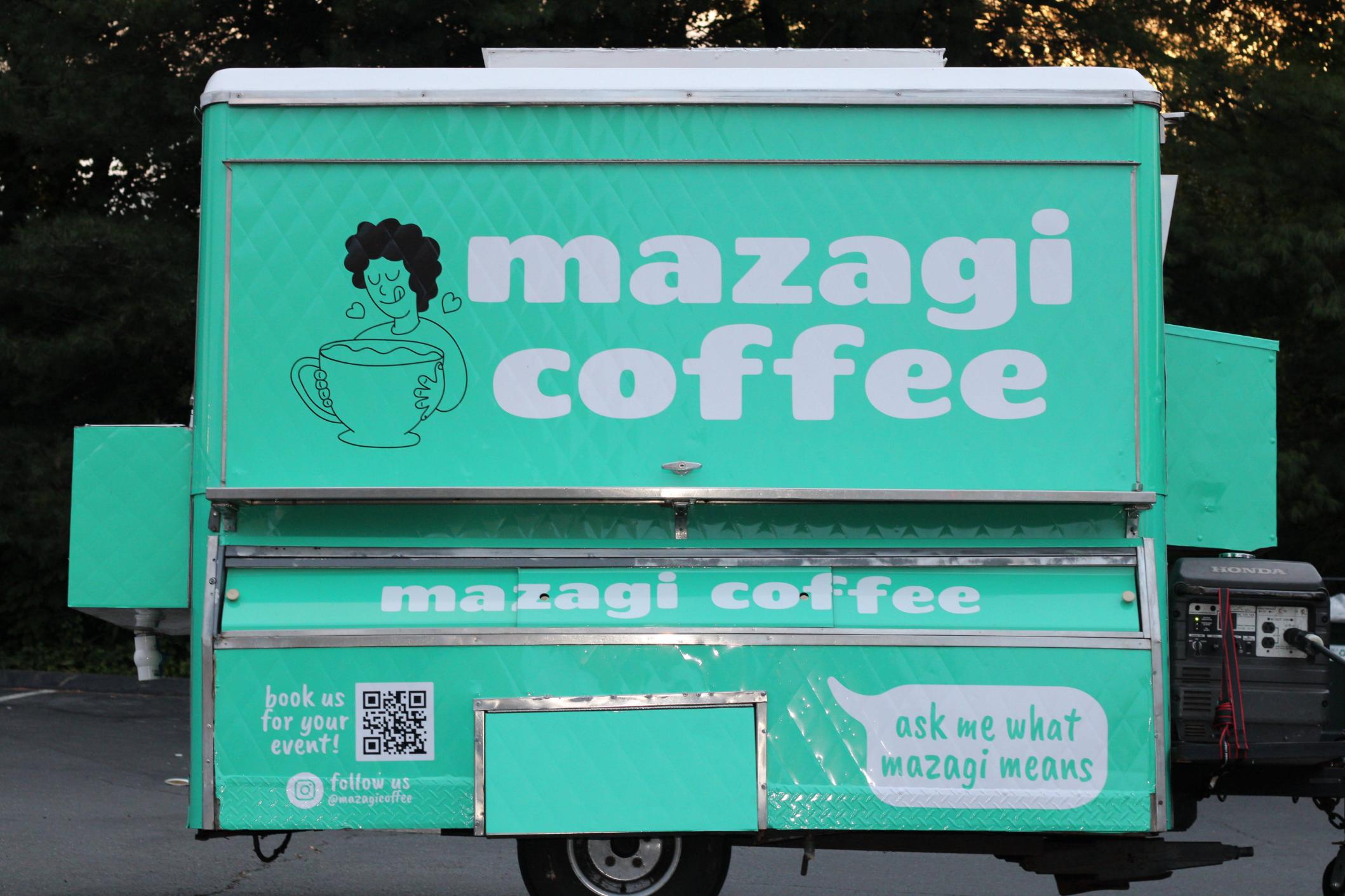 Mazagi Coffee founder standing in front of the branded cart