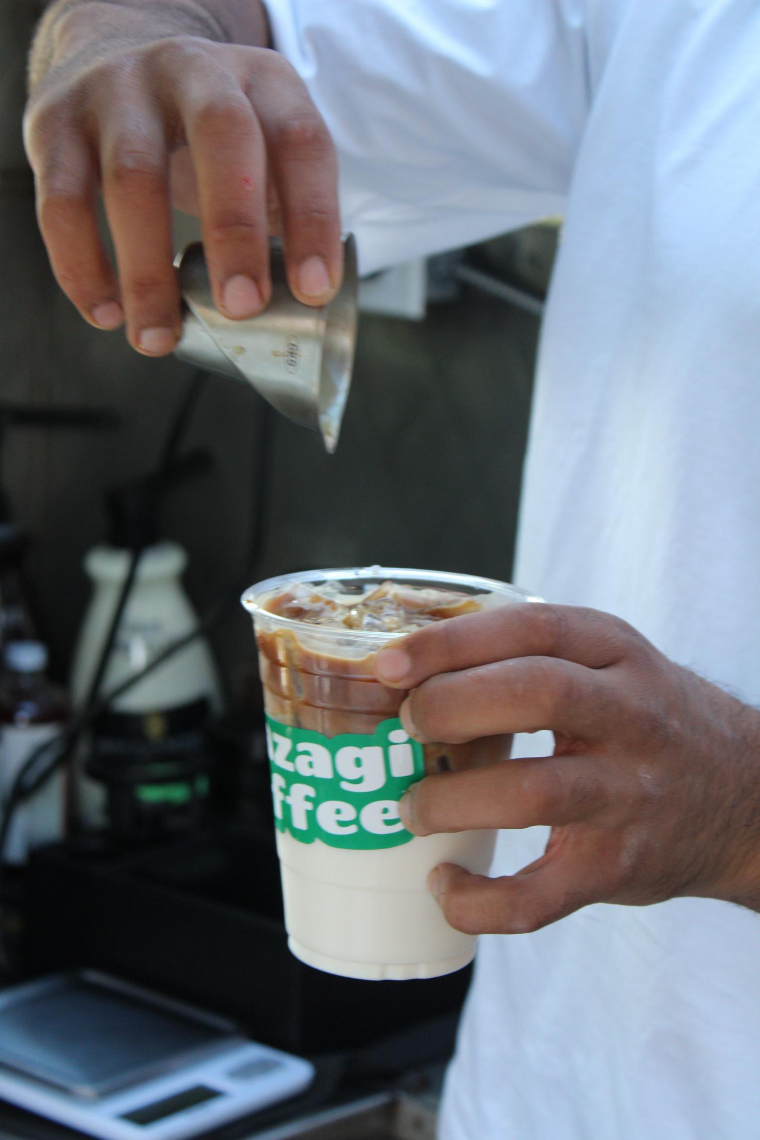Mazagi iced coffee being finished by hand